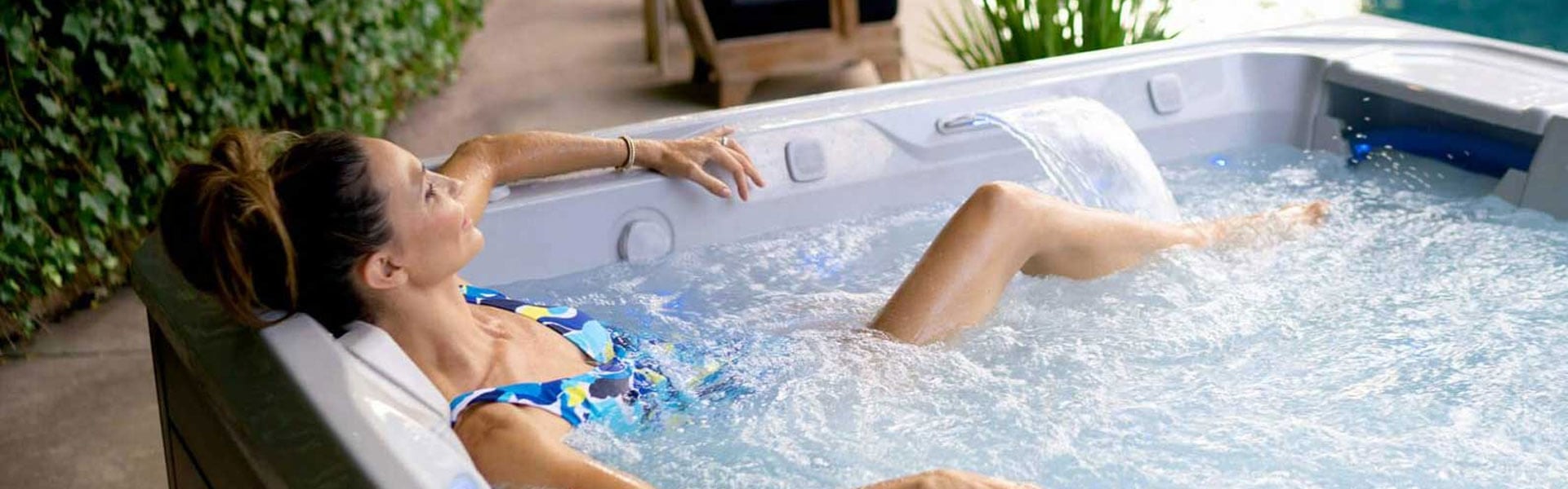 Woman relaxing in a salt water hot tub